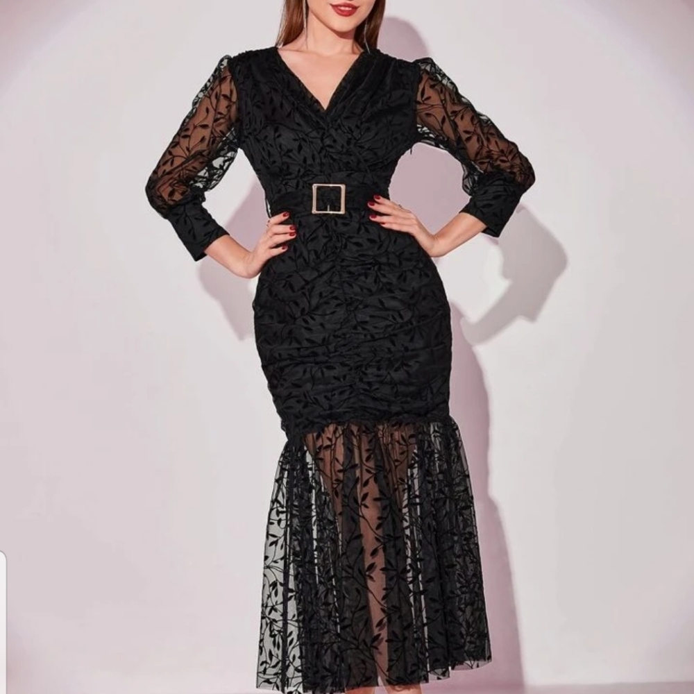 Firm fitting black modely mermaid hem dress size 12 or xL.